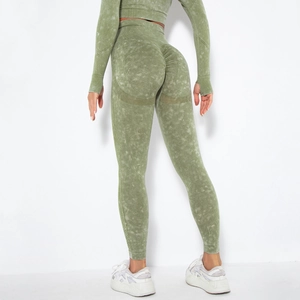 Detail view of seamless high waist scrunch butt yoga leggings in olive marble wash texture