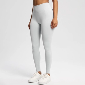 Detail view of light grey high-waisted seamless yoga leggings with peach lift effect
