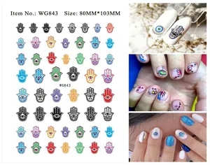 Detail view of Evil Eye and Hamsa hand nail art stickers with product size measurements
