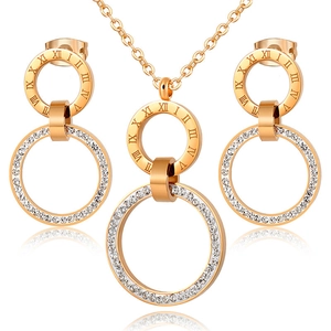 Rose gold necklace and earrings set with Roman numerals and pavé crystals