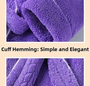Detailed macro view of the white cuff piping on a thick purple coral fleece bathrobe