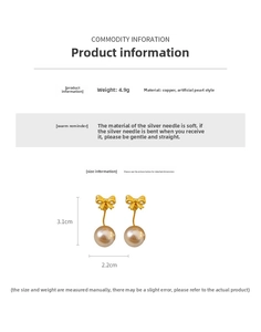 Close-up of golden bow earrings with pearl pendant, copper base and silver pins