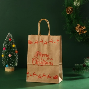 Brown kraft paper Christmas gift bag with reindeer print and festive decorations