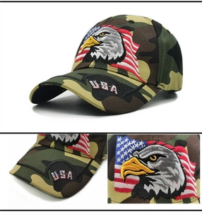 Macro detail of USA eagle embroidery and flag on camo baseball cap with 3D texture