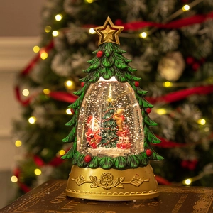 Green Christmas tree snow globe with Santa Claus on golden base and warm LED lights