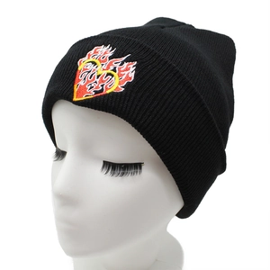 Unisex black knitted beanie featuring vibrant fire heart embroidery on the cuff