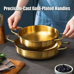 Golden stainless steel seafood pot set with cast gilded handles for elegant cooking
