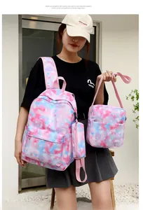 Outdoor shot of stylish pink and blue tie-dye star pattern backpack three-piece set
