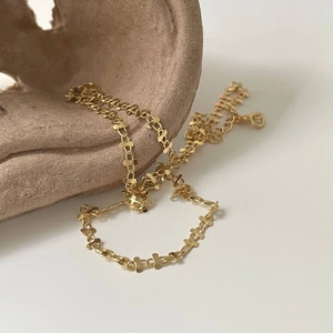 Detailed view of the 18K gold-plated S925 silver necklace with unique butterfly chain links