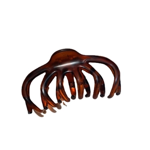 Large leopard print hair claw clip in amber brown with an elegant French design