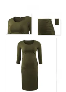 Detail of olive green maternity dress showing ruched side seams and soft knit fabric texture