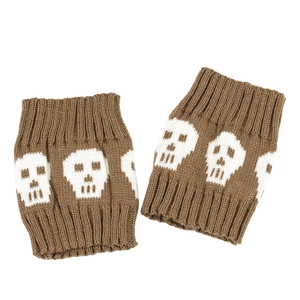 Close-up of brown knitted boot cuffs with white skull patterns and ribbed elastic edges