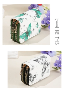 Détail des porte-cartes à double fermeture éclair avec imprimé papillon élégant