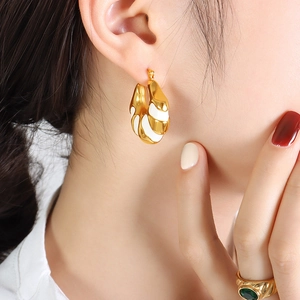 Vintage 18K gold plated C-shaped earrings with white enamel and green gemstone ring