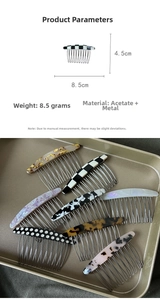 Detail view of 8.5cm acetate hair comb showing tortoiseshell and marble patterns