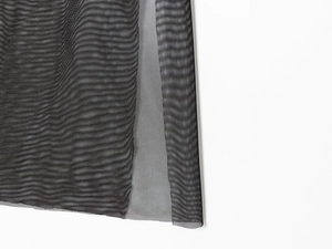 Close-up of black breathable mesh fabric texture for a double-layer fashion dress