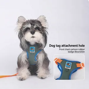 Breathable dog harness with grey-green fabric and orange straps on a Schnauzer dog