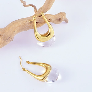 Boucles d'oreilles vintage en acier titane doré avec gouttes en résine transparente
