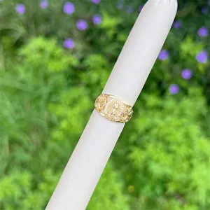 Detail of 18K gold-plated Virgin Mary ring featuring pave white zircons and floral band
