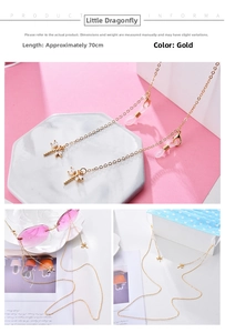 Detailed view of 70cm gold glasses chain with dragonfly pendants and crystals