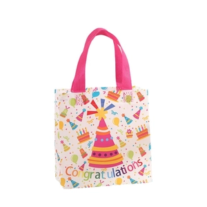 Non-woven party gift bag with pink handles, balloons, cake, and Congratulations print