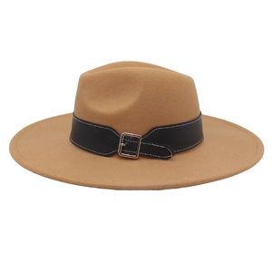 Detail of camel wool felt fedora featuring a black leather band with silver metal buckle
