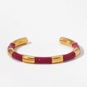Luxurious gold-plated C-shaped open bangle with elegant red enamel segmented design
