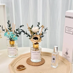 Close-up of reed diffuser set with 120ml wild bluebell oil, perfume and dried flowers