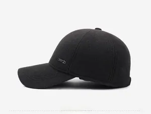 Side view of men's dark grey winter baseball cap featuring warm fabric and metal sport tag
