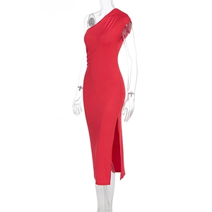 Detail view of red one-shoulder dress featuring side slit and elegant waist pleats