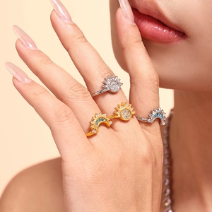 Three-piece sun and moon zircon rings in gold and silver finish with blue crystal inlays