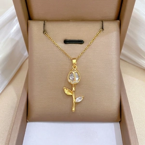 Elegant gold tulip pendant necklace with large zircon teardrop and sparkling accents
