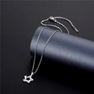 Star pendant necklace with baguette-cut cubic zirconia in silver-tone titanium steel