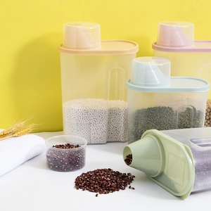 Transparent plastic food storage containers with colored measuring cup lids for grains