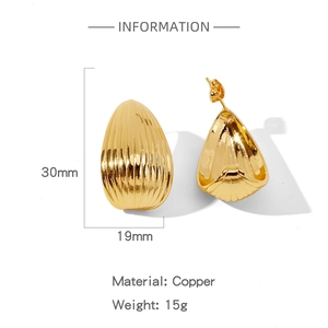 Detailed view of irregular golden drop earrings showing 30mm height and 19mm width size