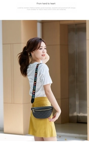 Detail of black quilted waist bag featuring adjustable strap with colorful LOVE lettering