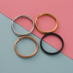 Flat lay of colorful stainless steel key rings in silver, gold, and rose gold finishes