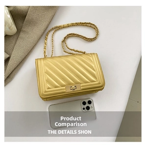Golden quilted crossbody bag size comparison with smartphone showing metal chain strap
