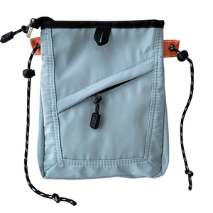 Unisex light blue nylon crossbody phone bag with orange accents and black drawstring