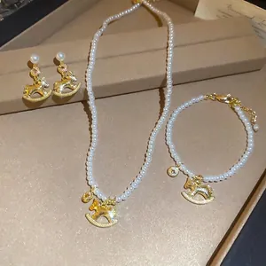 Exquisite rocking horse jewelry set with pearls and rhinestones on a vintage gift box