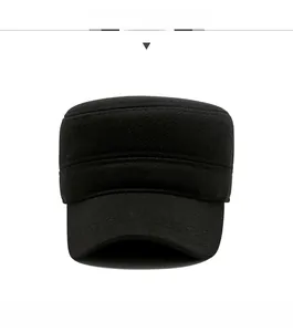 Front view of black wool flat cap with vintage gold shield metal emblem for men