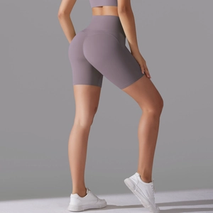 Detail showing the seamless back of lavender high-waisted yoga shorts with lifting seam