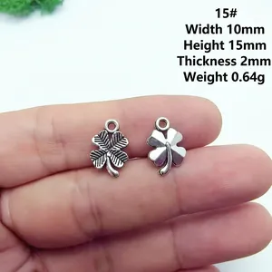 Detailed view of silver clover charms showing dimensions 10x15mm and 2mm thickness