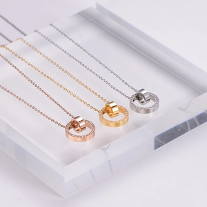 Three necklaces in rose gold, gold, and silver with double interlocking crystal rings