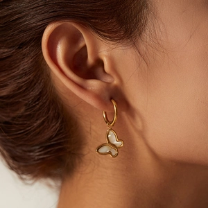 Elegant 18K gold plated butterfly drop earrings with white shell inlay on model