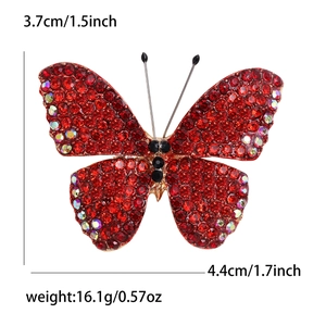 Elegant butterfly brooch with red rhinestones and alloy base showing 4.4cm width and weight