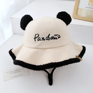 Close-up of baby panda bucket hat featuring corduroy fabric and plush faux fur trim