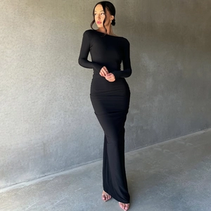 Detailed view of black slim fit maxi dress featuring pleated texture and side slit design