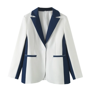 Detail of color-block blazer with white body, navy blue lapels and single button closure