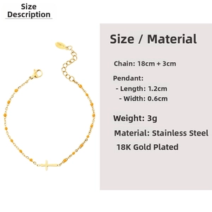 Detail of 18K gold plated stainless steel bracelet with yellow beads and cross charm